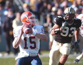 Illinois´ quarterback Tim Brasic looks to pass the ball while being approached by Purdue´s Tremayne Walker on Saturday in West Lafayette, Ind. Peter Hoffman
