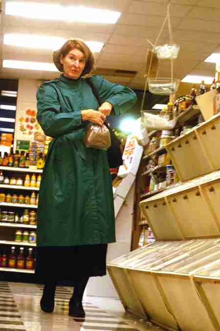 Janice Dalal of Monticello shops for grain on Sunday afternoon at Strawberry Fields organic food store in Urbana. Dalal says she shops at Strawberry Fields because "I like the nuts and grains in the bins." Tessa Pelias
