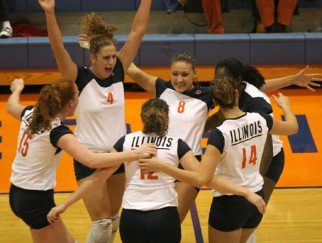Illinois´ teammates celebrate after scoring a point in the match against Ohio State on Friday at Huff Hall. Illinois, lost the match 3-0. Read more about the volleyball game on B-2. Josh Birnbaum
