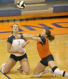 Illinois´ Beth Vrdsky cuts off Stephanie Obermeir to bump the ball during the match against Purdue on Wednesday night, Nov. 16 at Huff Hall. Adam Babcock
