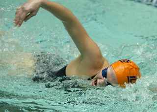 Barbie Viney swims the 400-yard freestyle relay against Indiana at the Intramural and Physical Education Building Pool on Dec. 4, 2004. Daily Illini File Photo
