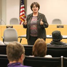 Tracy Stewart of the Illinois Student Assistance Commission speaks to students and parents in the Urbana City Council Chambers on Wednesday night about financial aid. Hosted by Rep. Naomi Jakobsson, the forum discussed scholarships, loans, and filling out Josh Birnbaum
