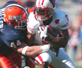 Illinois linebacker Brit Miller tackles Wisconsin´s Brian Calhoun during the first half of the game on Oct. 28 at Memorial Stadium. Daily Illini File Photo
