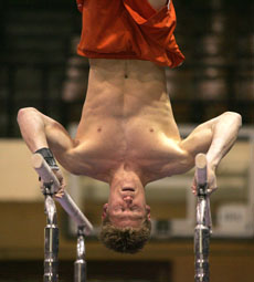 Justin Spring competes Friday on the parallel bars at the Mixed Pairs Exhibition at Huff Hall. Josh Birnbaum
