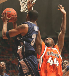 Illinois´ Marcus Arnold blocks Georgetown´s Darrel Owens in the game on Thursday at Assembly Hall. Arnold played 22 minutes, helping Illinois to win, 58-48. Josh Birnbaum
