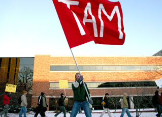 Rye Waldman, junior in Engineering, waves a flag at the Save TAM rally Wednesday outside of the Engineering Sciences Building at 1101 W. Springfield Ave., Urbana. The rally was held to protest the Interim Dean of Engineering´s proposed merger betwe Regina Martinez
