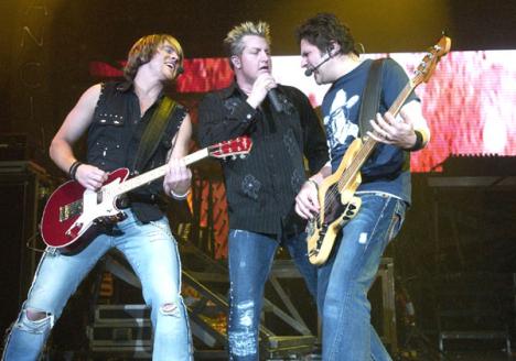 Joe Don Rooney, Jay Demarcus and Gary LeVox of Rascall Flatts perform Prayin´ for Daylight on Saturday night at Assembly Hall. The performance was their last show of the Here´s to You Tour. Adam Nekola

