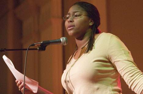 Ashanti Barber, Sophomore in LAS, performs a poem during a poetry slam held in the Courtyard Cafe of the Union, Jan. 27. Barber, who admits she has not written much since high school, took second place at her very first poetry slam. Sponsored by Illinit Adam Babcock
