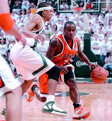 Chester Frazier is guarded by Shannon Brown of Michigan State in East Lansing on March 4. Illinois beat Michigan State 75-68 to finish the regular season 25-5 (11-5). Adam Nekola
