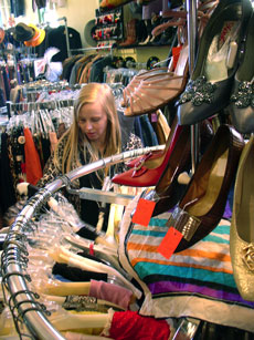 Kristin Schar, a graduate student, sorts through a rack of tops at Dandelion boutique on Saturday afternoon. Amelia Moore
