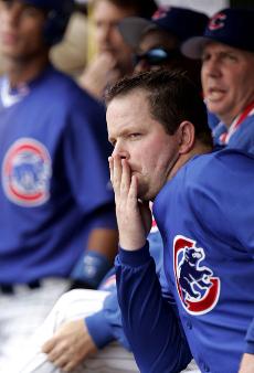 Chicago Cubs starting pitcher Glendon Rusch watches teammates play in the fourth inning against the Cincinnati Reds during a baseball game at Wrigley Field, Tuesday in Chicago. The Associated Press
