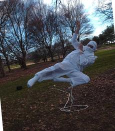 Jason Hamilton, junior in LAS, swings from a tree while dressed as a Ninja on Friday afternoon in the Arboretum. Hamilton was working on his preformance for the upcoming Housing Film Festival, which will take place on April 11, at the Courtyard Cafe. Tessa Pelias
