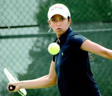 Shivani Dave returns the ball during a doubles match against Wisconsin at the Atkins Tennis Center on April 16. Dave and her teammate, Brianna Knue, won the match 8-5. Beck Diefenbach
