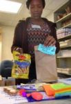 Nneamaka Onyejekwe, graduating student in MCB hands out stress packets at McKinley on Friday. Stress packets include complimentary snacks, toys, stress balloons and pamphlets on how to relax during finals week. This is one way the University helps students during stressful periods such as  midterms and finals.
