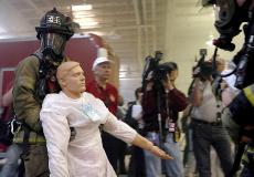 A firefighter removes a "victim" as part of a large-scale training exercise Wednesday, in Glenview, Ill. In a program coordinated by local state and federal agencies under the guidance of the U.S. Department of Homeland Security, first responders, firefig The Associated Press
