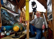 Lon Furness, 66, sits March 7, in an observatory he created in the attic of his Peoria Ill., home. The Associated Press
