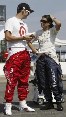 Dan Wheldon, left, and Danica Patrick talk on pit road as they wait for qualifying to begin for the Firestone Indy 200 at Nashville Superspeedway in Gladeville, Tenn., on July 14. The Associated Press
