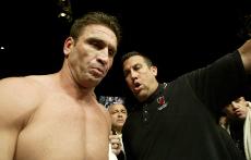 John McCarthy guides Ken Shamrock into the arena to fight Tito Ortiz for the light heavyweight bout as part of the Ultimate Fighting Championship 61 in Las Vegas on Saturday. Ortiz defeated Shamrock in the bout. After nearly folding in 2003, the league is The Associated Press
