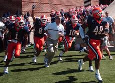 Ron Zook leads the Illinois football team out of the locker room before the home game against Rutgers. Zook and the rest of the Fighting Illini will look wins in 2006 like the 2005 Rutgers match. Peter Hoffman
