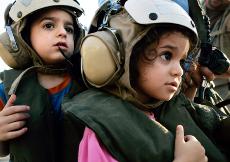 American children prepare to board waiting helicopters to be evacuated from the grounds of the U.S. Embassy in Beirut, Lebanon on Tuesday. The U.S. ambassador said 320 Americans would be evacuated from Lebanon to Cyprus by the end of Tuesday and approxima The Associated Press
