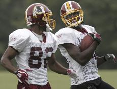 Washington Redskins wide receivers Antwaan Randle El, left, and Brandon Lloyd laugh at training camp, in Ashburn, Va. in this Aug. 10 file photo. The Associated Press
