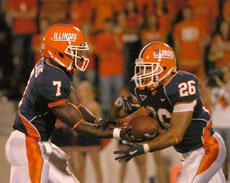 Quarterback, Isiah Juice Williams (7), hands the ball off to running back, E.B. Halsey (26), in the fourth quarter of the game against Eastern Illinois University on Saturday at Memorial Stadium. Illinois defeated Eastern, 42-17. Suzanne Stelmasek The Daily Illini
