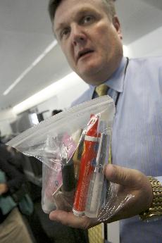Michael McCarron, director of Community Affairs at San Francisco International Airport, holds a bag of liquids and gel products which be allowed through security checkpoints under amended rules, Monday during a news conference at the airport in San Franci Tony Avelar, The Associated Press
