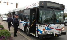 A bus driver and CUMTD officials part after an incident at the intersection of Neil and Green Streets at approximately 11:30 a.m. on Tuesday. According to the Champaign Police officer at the scene an MTD bus bumped into an unidentified man walking in the Patrick Traylor
