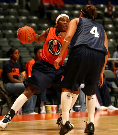 Adam Babcock The Daily Illini Illinois junior guard Rebecca Harris, left, tries to dribble around Maggie Acuna during the Orange and Blue Scrimmage at Assembly Hall, Sunday, October 29, 2006. Womens basketball played against a scout team consisting of seven male and one female player.
