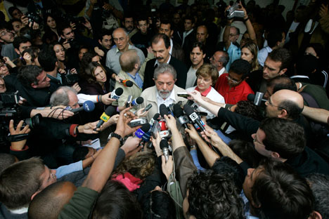 President Luiz Inacio Lula da Silva, candidate for re-election, center, speaks to journalists after voting in Sao Bernardo do Campo, Brazil, on Sunday, Oct. 1, 2006. AP Photos/Marcelo Hernandez

