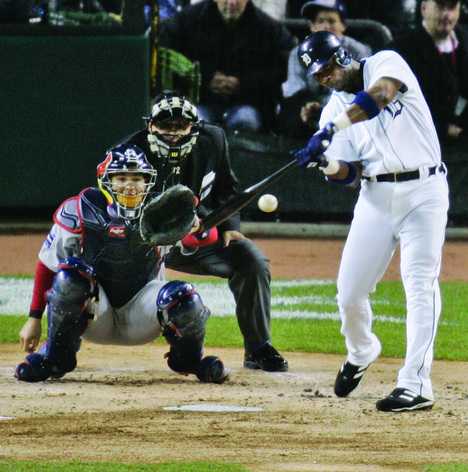 Detroit Tigers Craig Monroe hits a solo shot against St. Louis Cardinals starter Jeff Weaver in the first inning of Game 2 of the World Series on Sunday, Oct. 22, 2006 in Detroit. At left are St. Louis Cardinals catcher Yadier Molina, and homeplate umpire Alfonso Marquez. (AP Photo/Amy Sancetta)
