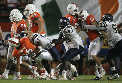 Miami and Florida International players brawl during the third quarter of a football game in Miami, Saturday. Miami won 35-0. The Associated Press
