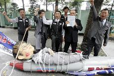 South Korean protesters shout slogans as they trample underfoot an effigy of North Korean leader Kim Jong Il during an anti-North Korea rally in front of the Government House in Seoul, South Korea, Monday, Oct. 9, 2006. North Korea said Monday it has perf Lee Jin-man, The Associated Press
