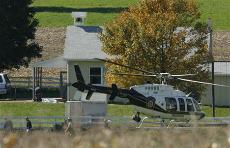 A police helicopter takes off from the scene of a school shooting in Nickel Mines, Pa., Monday, Oct. 2, 2006. USA Today/ The Associated Press
