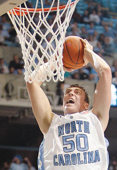 North Carolina's Tyler Hansbrough reacts after a slam dunk during