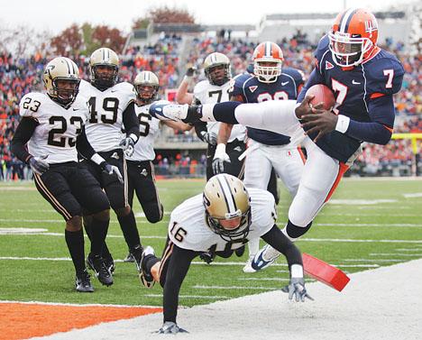 Josh Birnbaum The Daily Illini Illinois Isiah Williams is pushed out of bounds at the end zone by Purdues Brandon Erwin during the game at Memorial Stadium in Champaign, Ill., on Saturday, Nov. 11, 2006. Williams foot was in, thereby giving Illinois a touchdown in the first quarter, but Illinois lost, 42-31.

