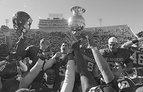 Indiana Hoosiers hoist the Old Brass Spittoon to their fans at Memorial Stadium in Bloomington, Ind., Saturday, Oct. 28. David Snodgress The Associated Press
