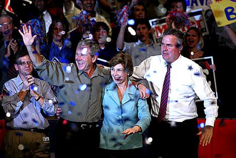 President Bush waves to the crowd with his wife, Laura, and brother Jeb Bush on Monday, Nov. 6, 2006, in Pensacola, Fla., where Bush was drumming up support for local Republican candidates. AP Photo/Mari Darr~Welch
