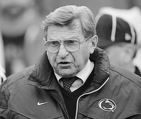 Penn State coach Joe Paterno runs onto the field against Wisconsin Saturday in Madison, Wis. Paterno left the game with a knee injury after getting hit. Morry Gash The Associated Press
