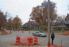 A pedestrian waits to cross Fourth Street at its intersection with Chalmers Street, where many changes are taking place. John Paul Goguen
