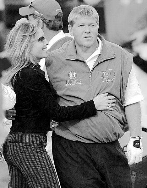 Golfer+John+Daly%2C+right%2C+is+hugged+by+his+wife%2C+Sherrie%2C+after+his+playoff+victory+in+the+Buick+Invitational+in+San+Diego%2C+on+Feb.+15%2C+2004.+Lenny+Ignelzi+The+Associated+Press%0A