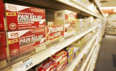 CVS brand acetaminophen, and Tylenol, are displayed on a rack, at a CVS store in Washington, Thursday. A major manufacturer of acetaminophen sold by Wal-Mart, CVS, Safeway and more than 100 other retailers recalled 11 million bottles of the widely used pa The Associated Press
