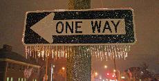 A one way sign on the corner of Goodwin and Springfield is laden with ice Thursday night. The University experienced freezing rain, which turned to snow later in the evening. Close to 2 inches accumulated on the ground. Brad Vest
