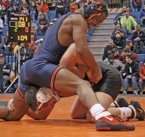 141 pound senior Cassio Pero, holds down Mike Parino from Findlay in a match at Huff Hall, Satuday, December 9, 2006. John Paul Goguen The Daily Illini
