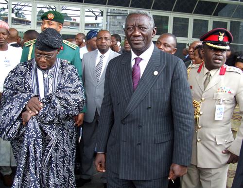 President John Kufuor of Ghana , center, leaves the 8th African Union summit as Nigerian President Olusegun Obasanjo look at his watch in Addis Ababa, Ethiopia, Monday, Jan. 29, 2007. The African Union chose Ghana to head the 53-member bloc Monday, for th The Associated Press
