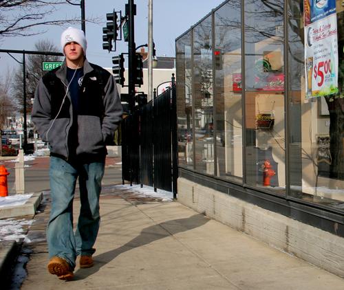 Tom Freyer, a junior in LAS, walks north on Forth Street Tuesday afternoon, January 23, 2007. A study conducted by the University of Illinois has shown that walking increases brain volume and can also stimulate cognitive functions. Joseph Lamberson
