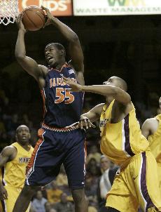 Illinois forward Shaun Pruitt (55) pulls down a rebound over Minnesota forward Bryce Webster, right, during the first half of the 64-52 Illini win over the Gophers in Minneapolis, Wednesday. Illinois has now won 16 consecutive contests over Minnesota. Ann Heisenfelt, The Associated Press

