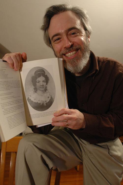 Robert D. Parker, professor of English and American Indian studies, poses with his new book, The Sound the Stars Make Rushing Through the Sky: The Writings of Jane Johnston Schoolcraft, on Tuesday, Jan. 23, 2007. Joseph Lamberson
