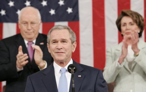 President Bush smiles as he arrives to deliver his annual State of the Union address to a joint session of Congress as Vice President Richard Cheney, left, and House Speaker Nancy Pelosi of Calif. applaud, on Capitol Hill in Washington, Tuesday, Jan. 23, Associated Press
