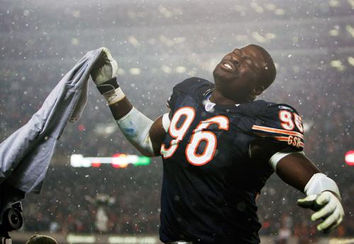 Chicago Bears defensive end Alex Brown (96) celebrates in the snow after the NFC championship football game against the New Orleans Saints, Sunday, Jan. 21, 2007, in Chicago. The Bears defeated the Saints, 39-14, to win the NFC title. (AP Photo/Nam Y. Huh)
